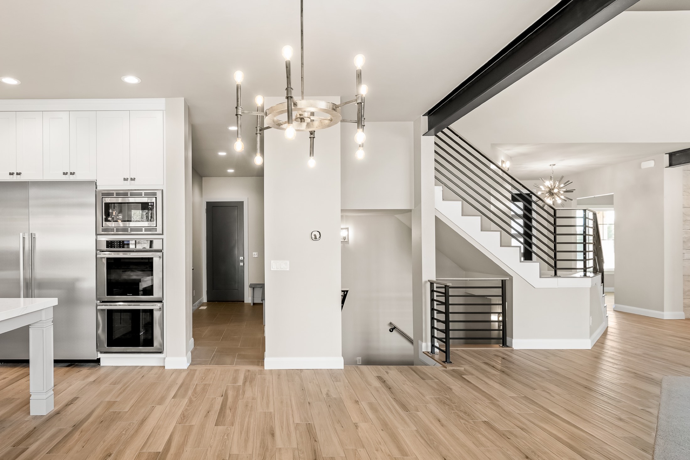 Two-story great room with black steel beams, Alpine, Utah