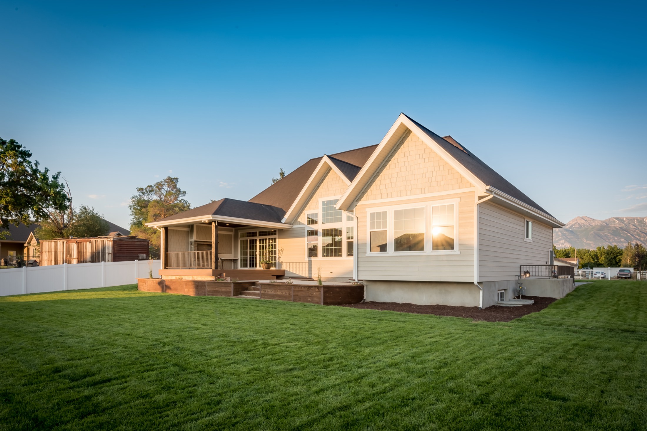 Backyard with covered deck and open lawn