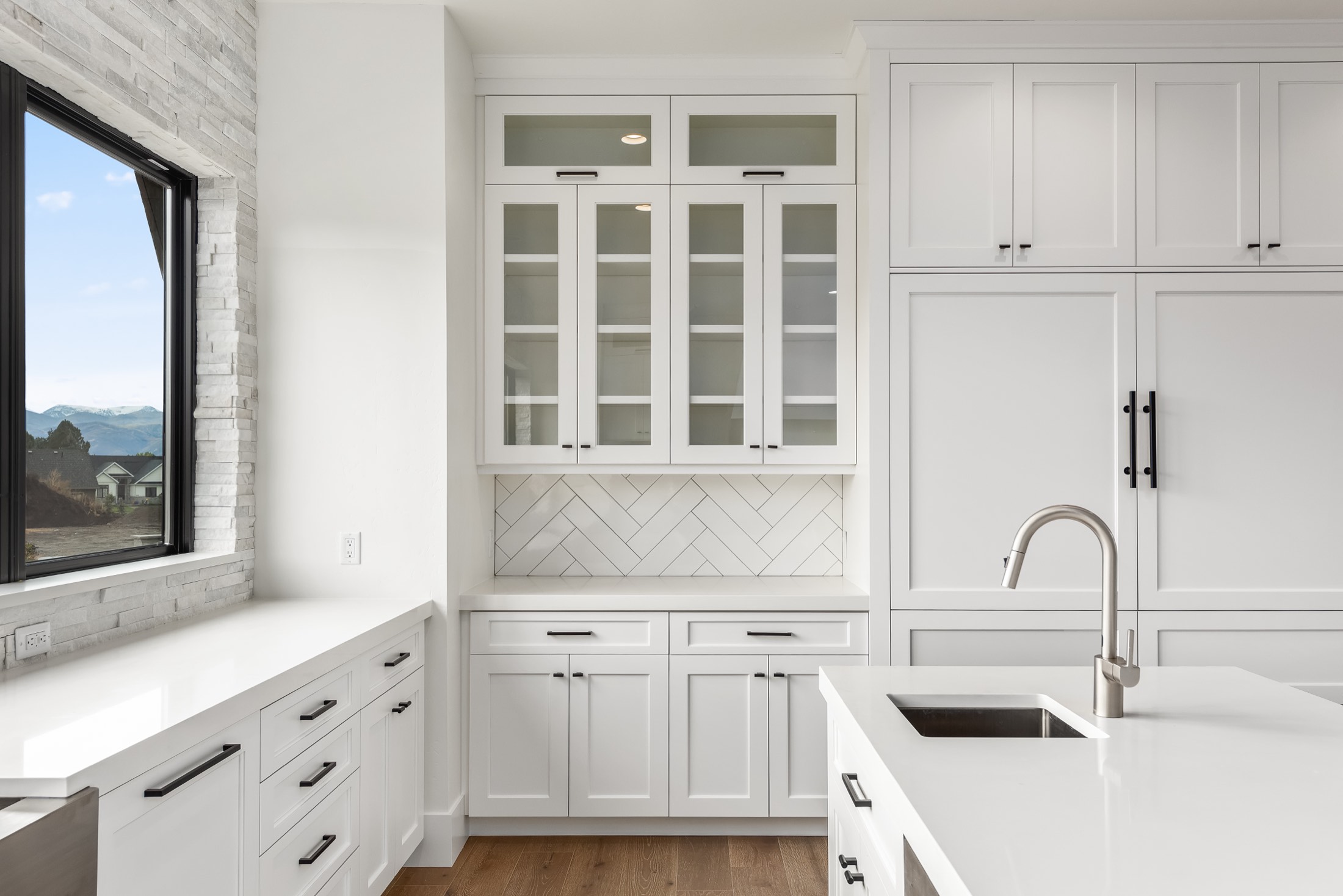 Back kitchen with glass-front cabinetry