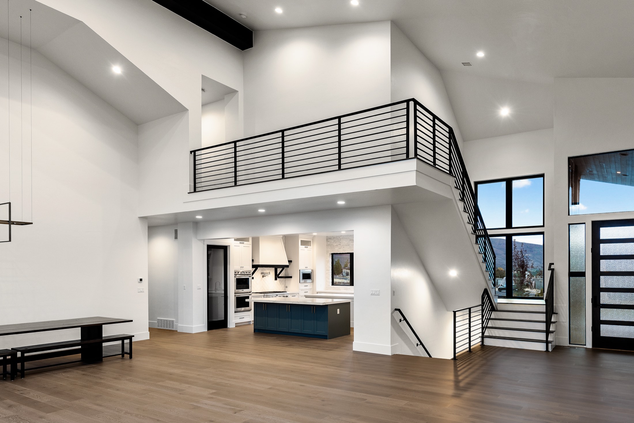 Great room, loft, and steel-railed staircase