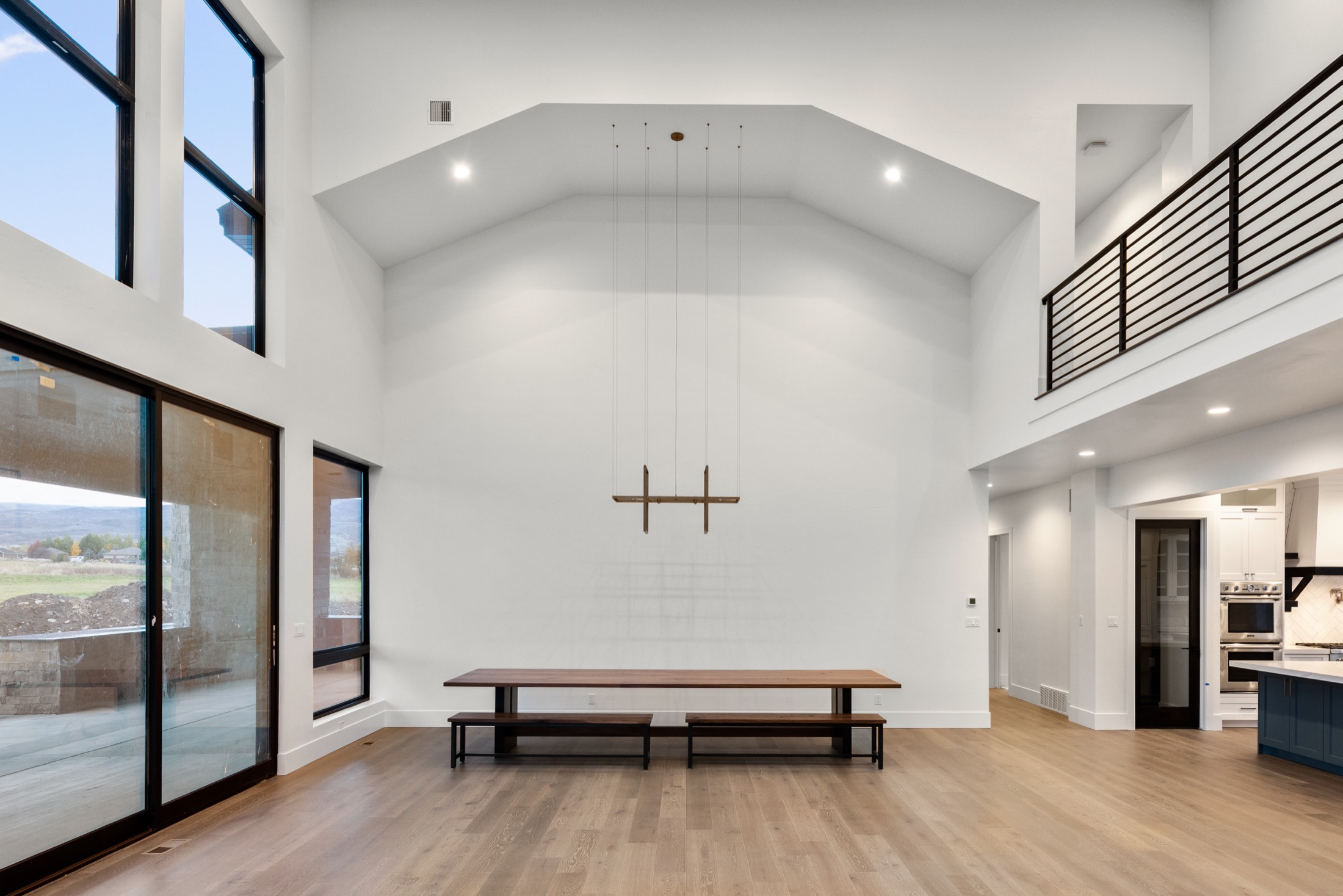 Vaulted great room with valley-facing window wall