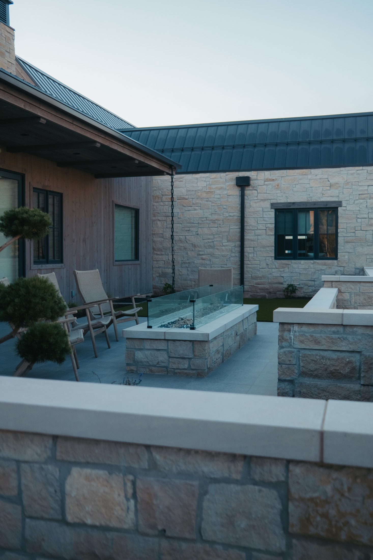 Outdoor terrace with stone fireplace